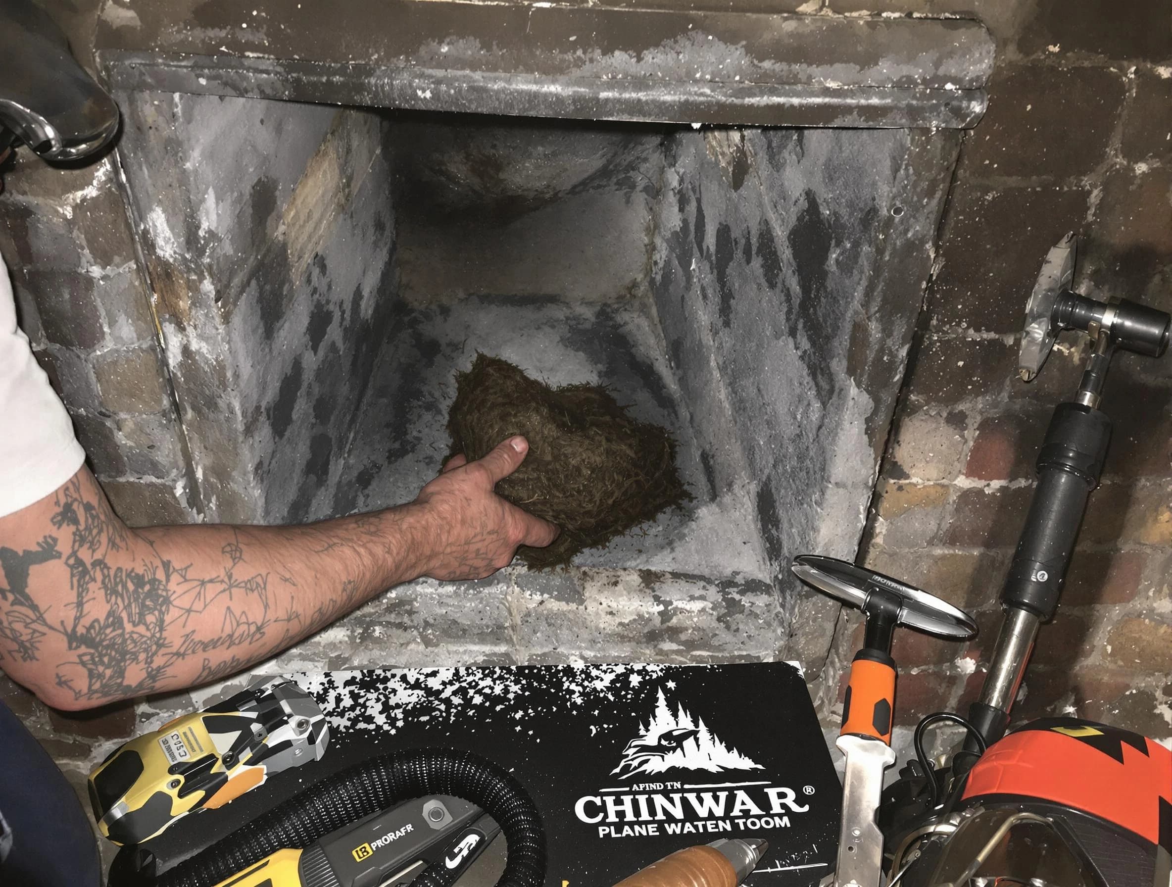 West Deer Chimney Sweep safely removing debris and screening chimney in West Deer, PA